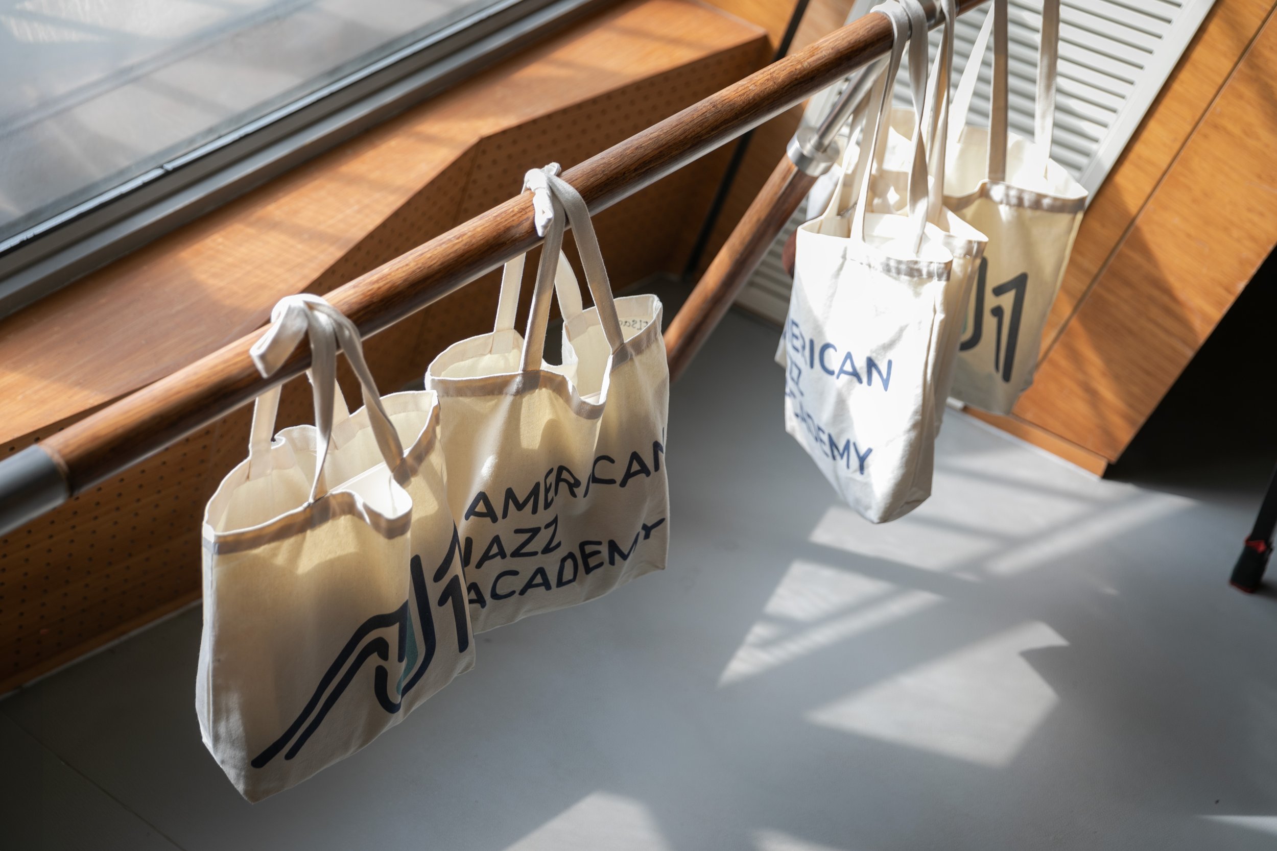 AJA Tote Bags