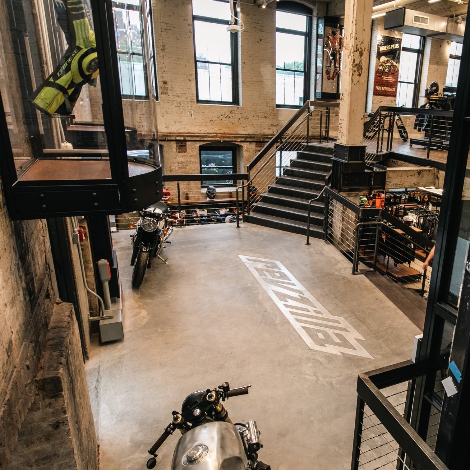 RevZilla floor graphic between the bike displays