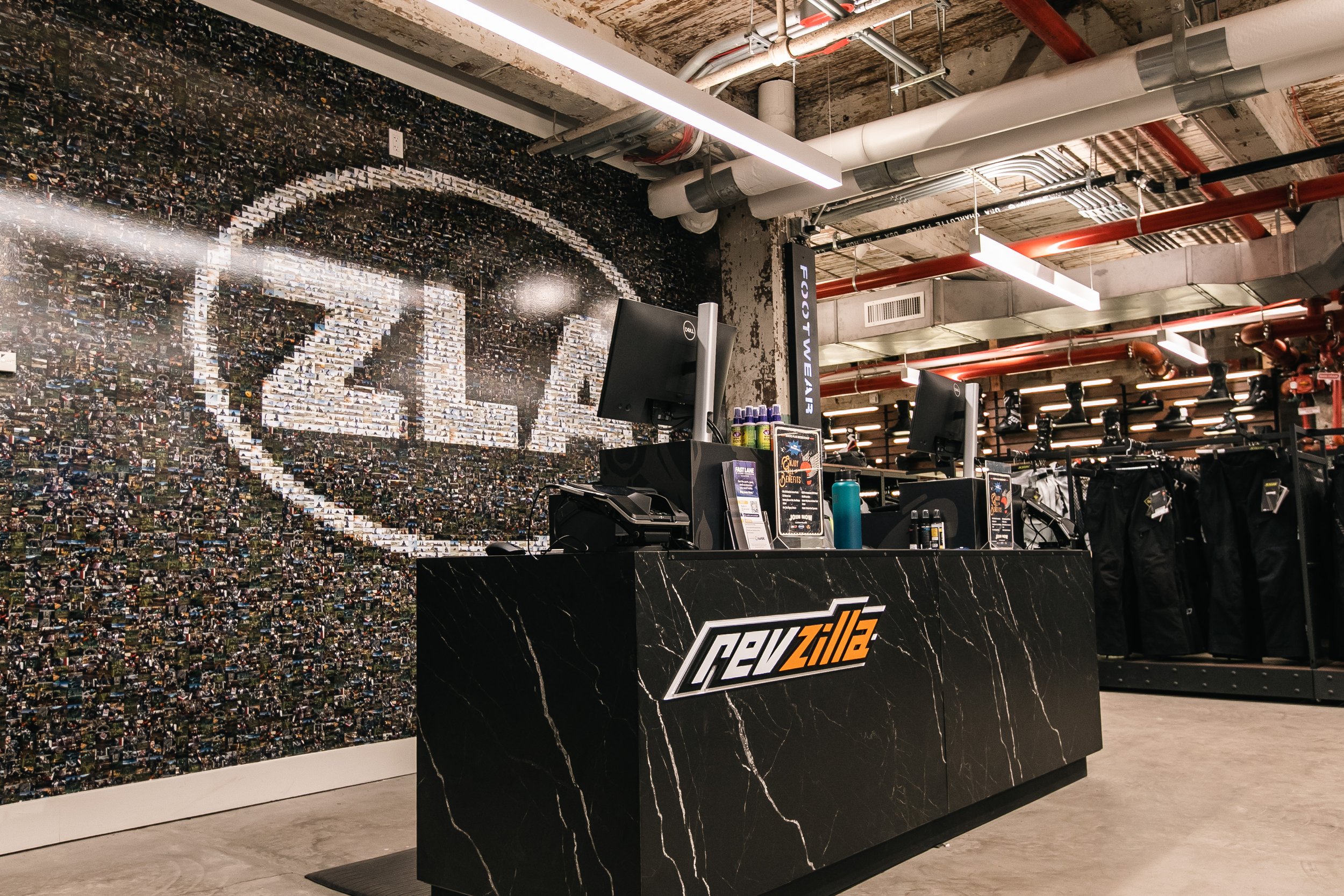 ZLA photo-mosaic feature wall behind the checkout counter